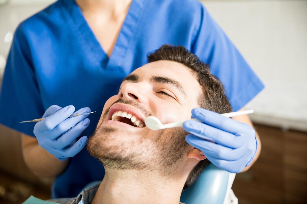 mid-adult-patient-receiving-dental-treatment-with-tools-from-female-dentist-clinic_662251-2562